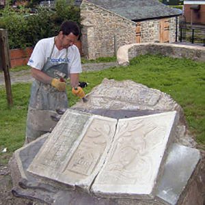 image of Anthony Lysycia woking on the sculpture