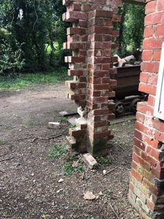 Bricks knocked from wall of Tally House